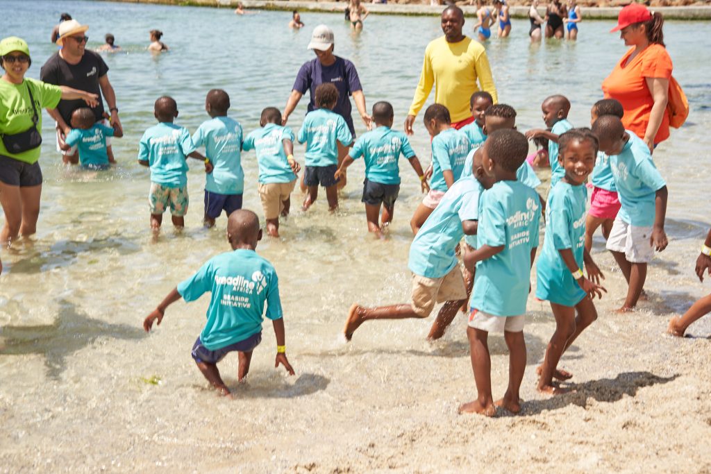 Help 240 township children experience the beach for the first time!